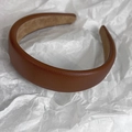 Detailed close-up of dark brown lychee texture leather headband with soft suede inner lining - Dark Coffee