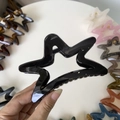 Close-up of star-shaped hollow hair claws in various vibrant colors on a white background - 11cm / Bright Black