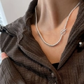 Silver interlocking coiled loop necklace with OT toggle clasp on model wearing dark brown shirt - Coil Wrapped OT Buckle Necklace (XL1494)