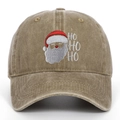 Macro shot of Santa Claus embroidery and HO HO HO text on washed cotton baseball cap - Khaki