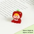 Miniature luminous resin apple doll on vintage book showing dimensions 16x20mm and 3g weight - Luminous Cherry