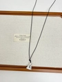 Macro detail of a silver money bag pendant with dollar symbol on a black wax rope cord - Silver Money Bag