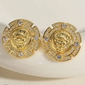 Detailed close-up of gold lion head earrings with white crystal pave in vintage style - Gold Lion Head Zirconia Stud Earrings
