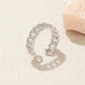 Macro detail of silver adjustable Cuban link ring with sparkling micro-pave crystals - Adjustable Open / Silver Chain Zirconia