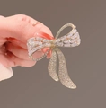 Golden sparkling crystal bow brooch with double-layer cubic zirconia inlays - Pave Bowknot