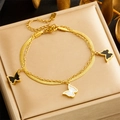 Double-layered gold chain bracelet with white and black butterfly pendants on jewelry box - Gold Double-layer Butterfly Style (B1376)