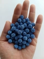 Close-up of sparkling royal blue 10mm disco beads held in hand for size visualization - 10mm / Sapphire Blue (17)