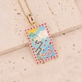 Macro shot of 18K gold plated tarot necklace with colorful zircon and enamel patterns - Cloud and Dragon Pattern Style (7#)