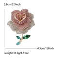 Elegante rozenbroche met roze strass-steentjes en gouden steel in volle kristalzetting - Roze
