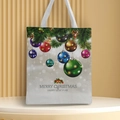 Detailed view of canvas tote bag with Christmas festive prints and white handles - Style 52