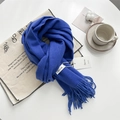 Royal blue cashmere-feel tassel scarf flat lay with cozy coffee and candle scene - Klein Blue