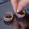Chic gold hoop earrings with multi-row purple crystal pave-set on a mirror base - Purple Pave Hoop / Purple