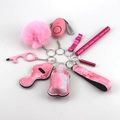 Pink self-defense keychain set featuring alarm, fluffy pompom, and wristlet strap detail - 15-Pink Solid