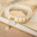 Bracelet tissé style ethnique avec perles œil de chat et breloques fleurs dorées - Style de Fleur de Verrouillage de Fortune de Nuage