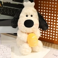 Cute plush puppy toy holding a yellow egg accessory in a warm office desk setting - 30cm Baking Style Dog