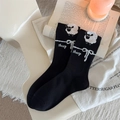 Cozy black cotton crew socks with white sheep and ribbon jacquard patterns in a soft setting - One Size / Black