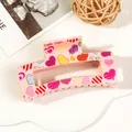 Detail of pink acrylic claw clip with colorful heart patterns on a stylish background - 8.5cm Heart Print - Style F Pink
