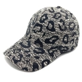 Close-up of the embossed lace texture and leopard print pattern on this stylish baseball cap - M (56-58cm) / Off White