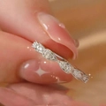Silver wavy ring with sparkling clear stones on a hand for a sophisticated jewelry look - Sugar Cube Ring Ljz--214 / Adjustable Open