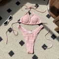 Pink smocked bikini set with drawstring halter top and high-cut bottom on plaid rug - S / Pink