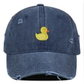 Close-up of yellow duck embroidery and distressed holes on navy blue washed denim cap - One Size / Navy Blue
