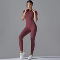 Close-up of a high-elastic yoga bodysuit with zipper collar and sleek short sleeves - Burgundy
