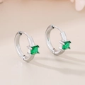 Macro view of silver quadrilateral hoop earrings with square green emerald glass stones - Steel Green (KE116269-GC)