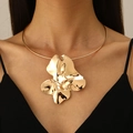 Irregular metal flower pendant collar necklace in glossy gold finish on model - Gold Abstract Flower Choker (G-431)