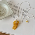 Detailed shot of yellow grape cluster beaded pendant necklace with silver snake chain - Style 6 Necklace