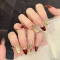 Faux ongles faits main de luxe avec dégradé rouge et or et décor de cœurs - Grand (L) / Ovale Long (1589)