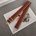 Macro shot of retro checkered colorful woven bag strap with golden metal hardware detail - Yellow Grey Brown + Gold Hook