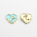 Detailed view of heart charms with blue enamel and golden rose motif on front and back - Blue-Gold