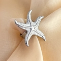 Elegant starfish shaped ring in silver finish on champagne silk with textured detail - Starfish Open Ring - Silver