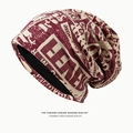 Slouchy burgundy newspaper print knitted beanie hat for a casual streetwear look - Newspaper Print Style / Burgundy