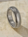 Macro detail of silver Tubogas style wide metal bracelet with industrial pleated texture - Silver 1.6cm