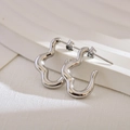 Irregular wavy silver stainless steel stud earrings with a polished minimalist aesthetic - Silver