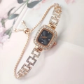 Macro view of rose gold square watch with crystal bezel and adjustable sliding buckle - Rose Gold Black Face