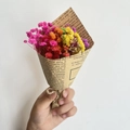 Detail of colorful mini gypsophila dried flowers wrapped in vintage newspaper style paper - Vintage Mini Multicolored Gypsophila