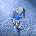Silver ring with blue heart gemstone and angel wing details on a bokeh background - Blue Diamond Ljz-204 / Adjustable Open