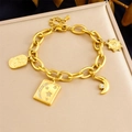 Gold plated stainless steel chain bracelet with star moon charms on a jewelry box - Gold Celestial Style (B1671)
