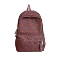 Dettaglio dello zaino marrone a pois con chiusure lampo e nappa intrecciata decorativa - Borsa Singola / Marrone