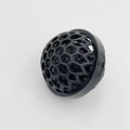 Detail of a black honeycomb sticky ball cleaner for removing dust from purses and bags - Black
