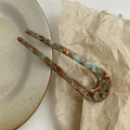 Detail of U-shaped acetate hair fork with green-brown marble texture on ceramic plate - 5.0mm Thick Mint Green