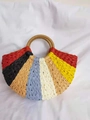 Detail of colorful striped woven straw bag with paper rope texture and round handles - Multicolor (Red Tone)