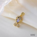Close-up of a fish-shaped gold pendant with moonstone and pavé-set zircons on soft background - D292 Moonstone Fish