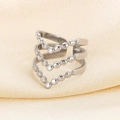 Close-up of silver layered V-shape ring with bead accents on yellow silk fabric - V-Shape Beads (KR105367)