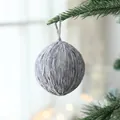 Gray wool felt Christmas ball ornament 6cm diameter hanging on a pine tree branch - Gray