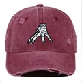 Detail of distressed burgundy baseball cap featuring white palm embroidery and worn edges - One Size / Burgundy