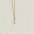 Gold stainless steel pearl necklace featuring an elegant letter V pendant design - Letter V