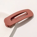 Detail view of large matte brick red hair clip with hollow rectangular design and duckbill clip - Matte Hair Clip Large - Orange